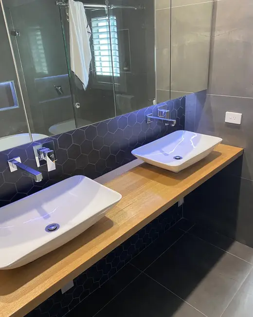 Renovated bathroom with a double vessel basin vanity