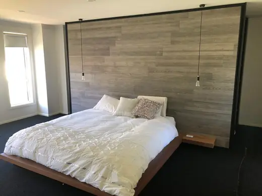 Bedroom with a timber feature wall