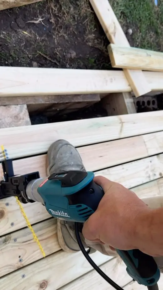 Cordless drill fixing timber framing