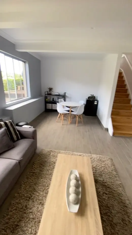 Open-plan living room with timber floors