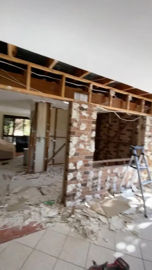 Renovation with a wall opened up for a new doorway