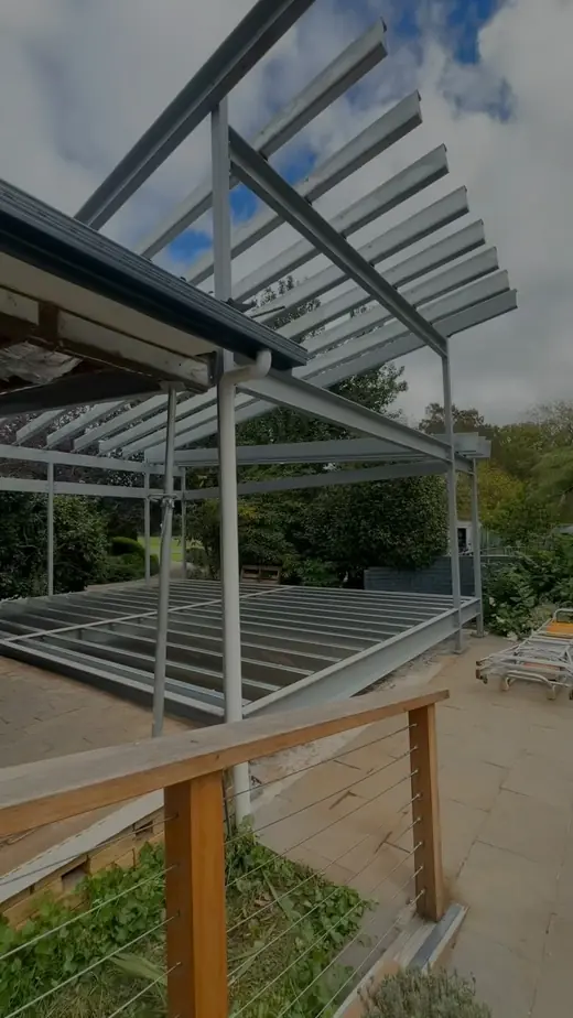 Steel pergola frame on timber posts