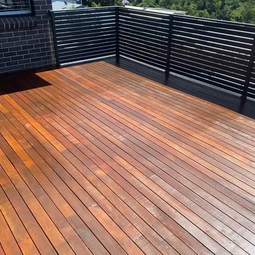 Timber deck with a black slat balustrade