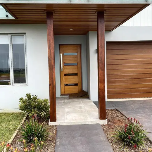 Entry with timber posts and a timber front door